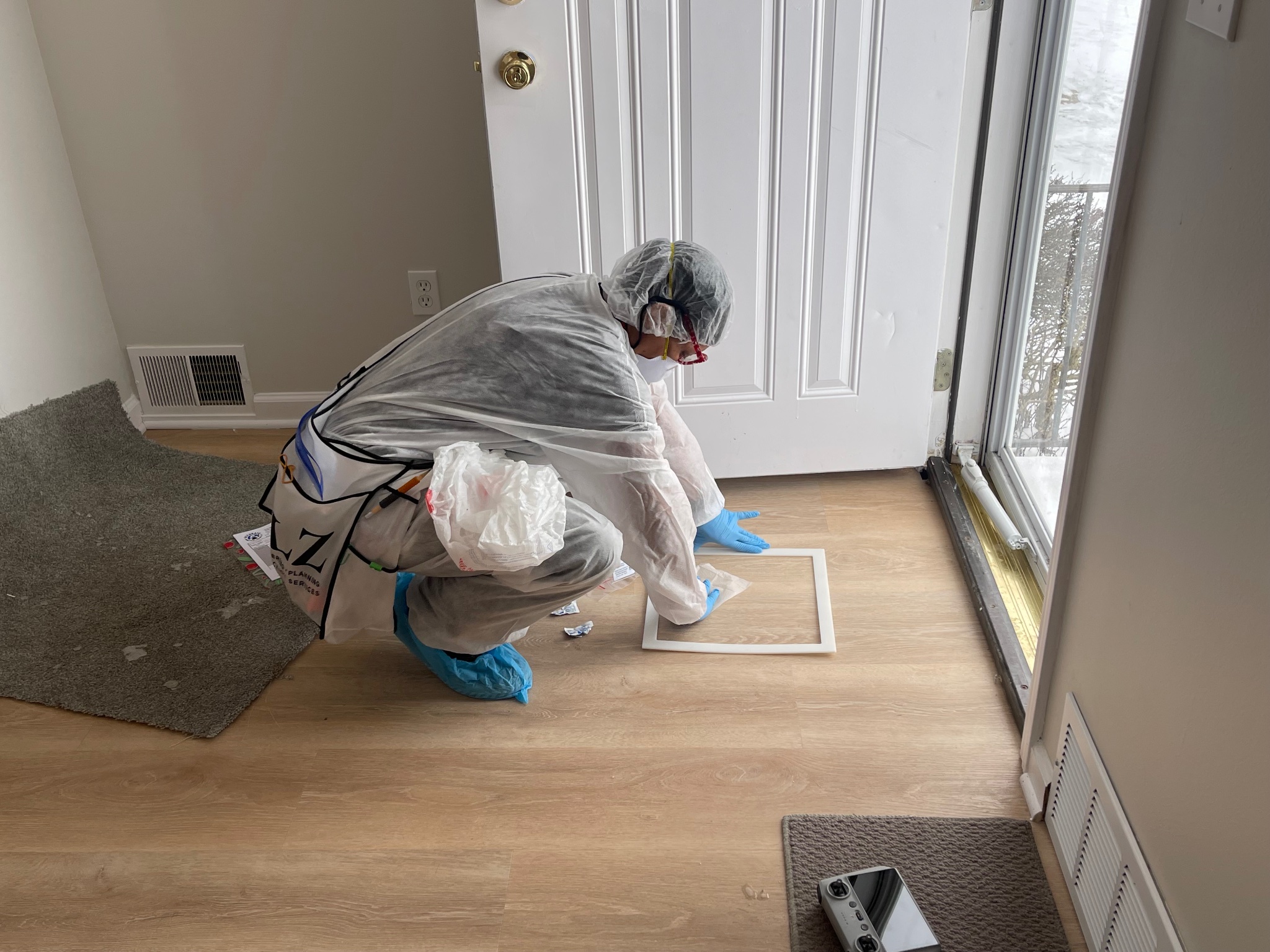 Inspector collecting floor sample