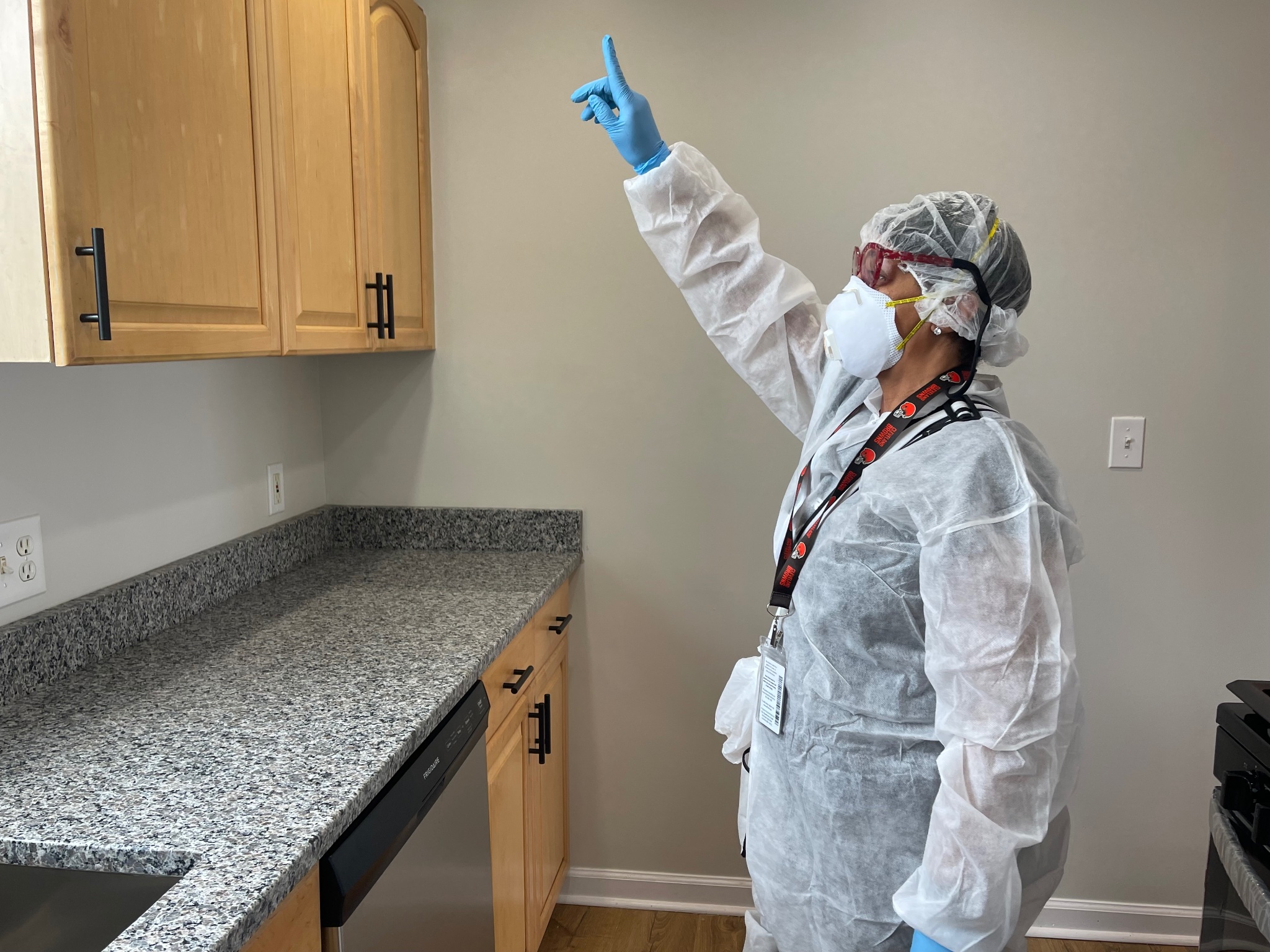 Lead inspection professional assessing a building